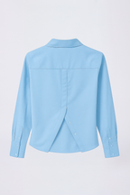 BLUSA CAMISERA CON BOTONES DELANTEROS Y POSTERIORES CELESTE - BILBAO